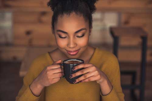 Lady drinks coffee